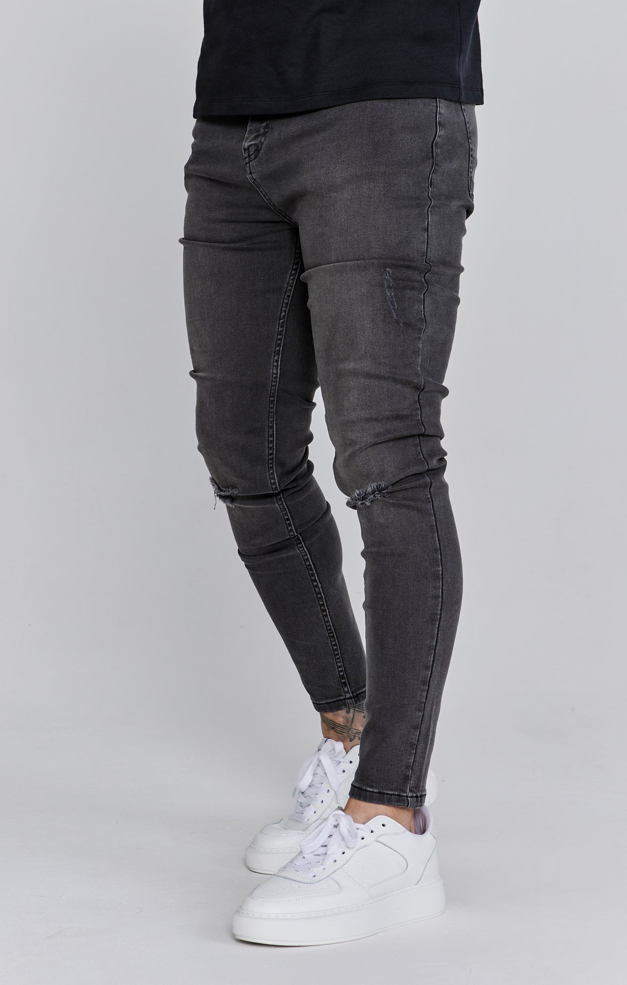Distressed Skinny Jeans in Grey Jeans SikSilk