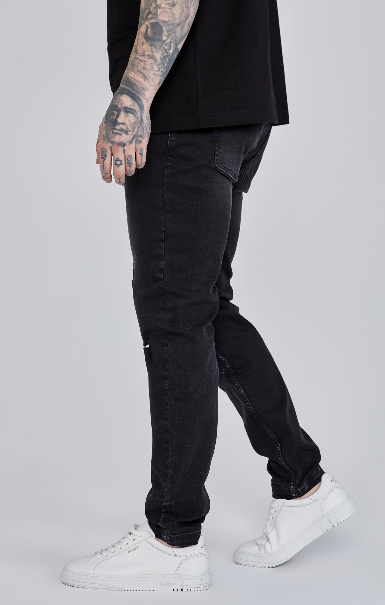 Distressed Slim Fit Jeans in Black Jeans SikSilk