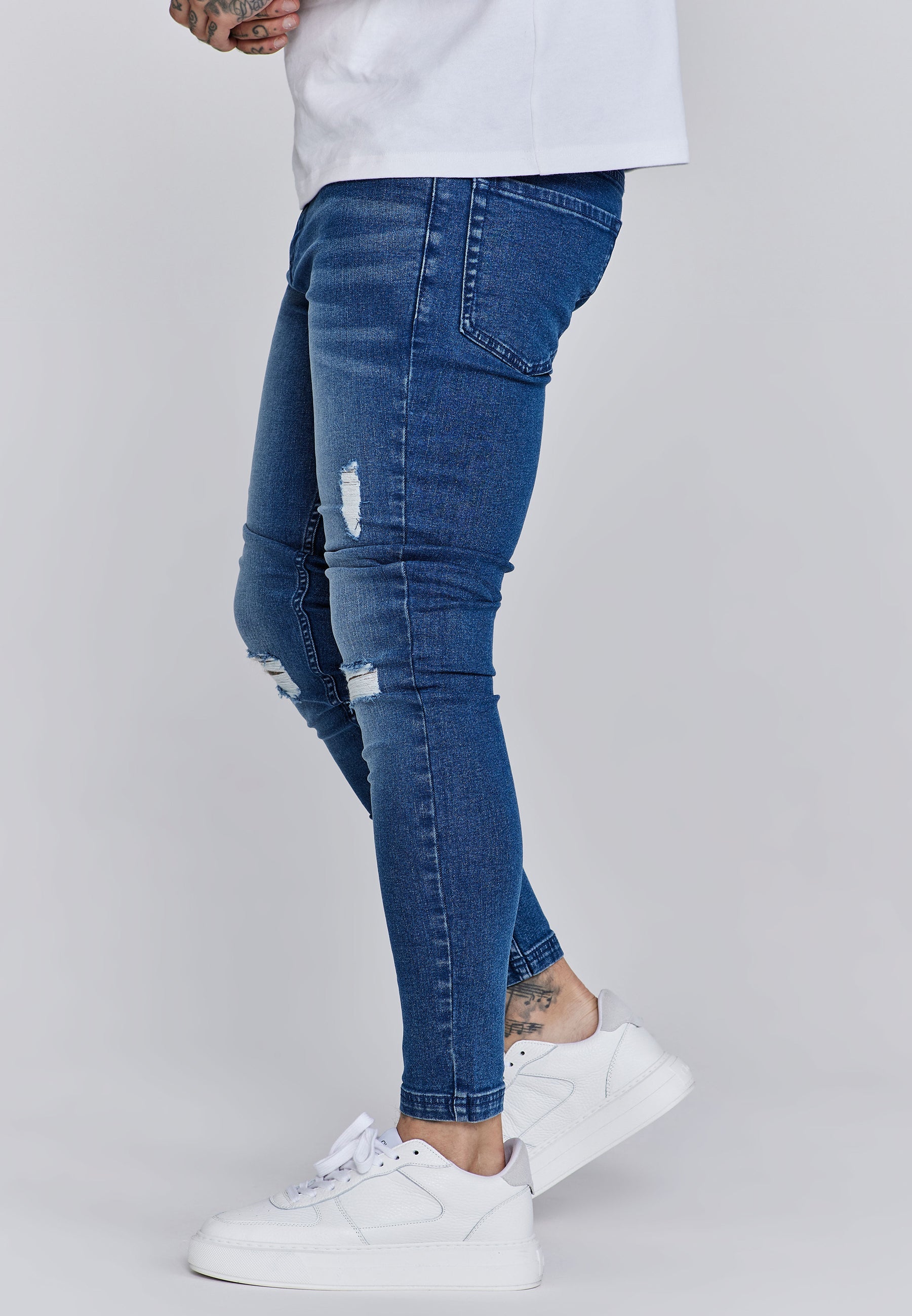 Distressed Skinny Jeans in Blue Jeans SikSilk