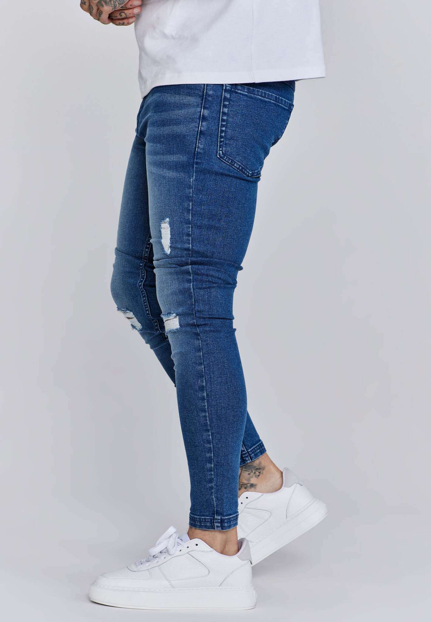 Distressed Skinny Jeans in Blue Jeans SikSilk