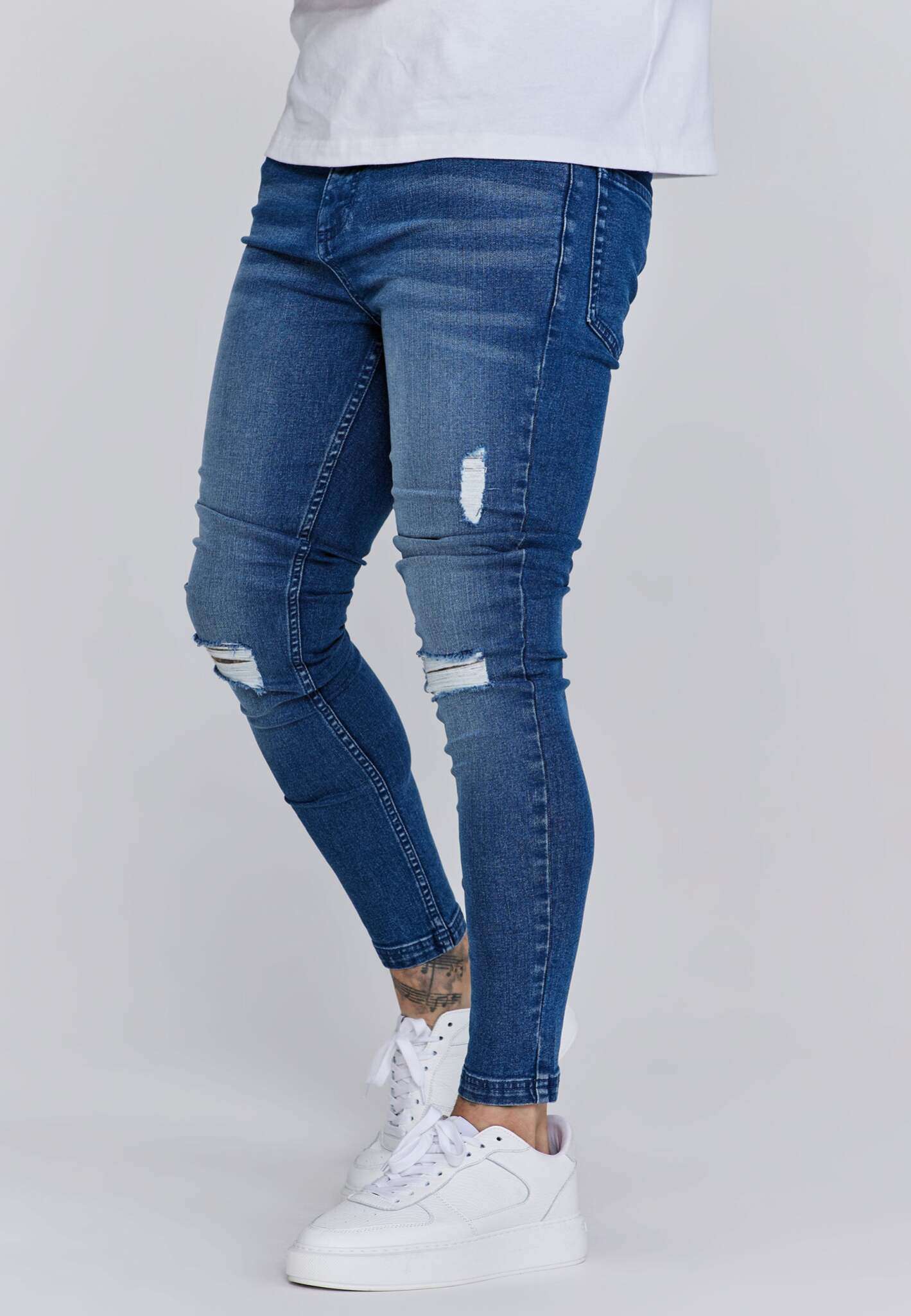 Distressed Skinny Jeans in Blue Jeans SikSilk