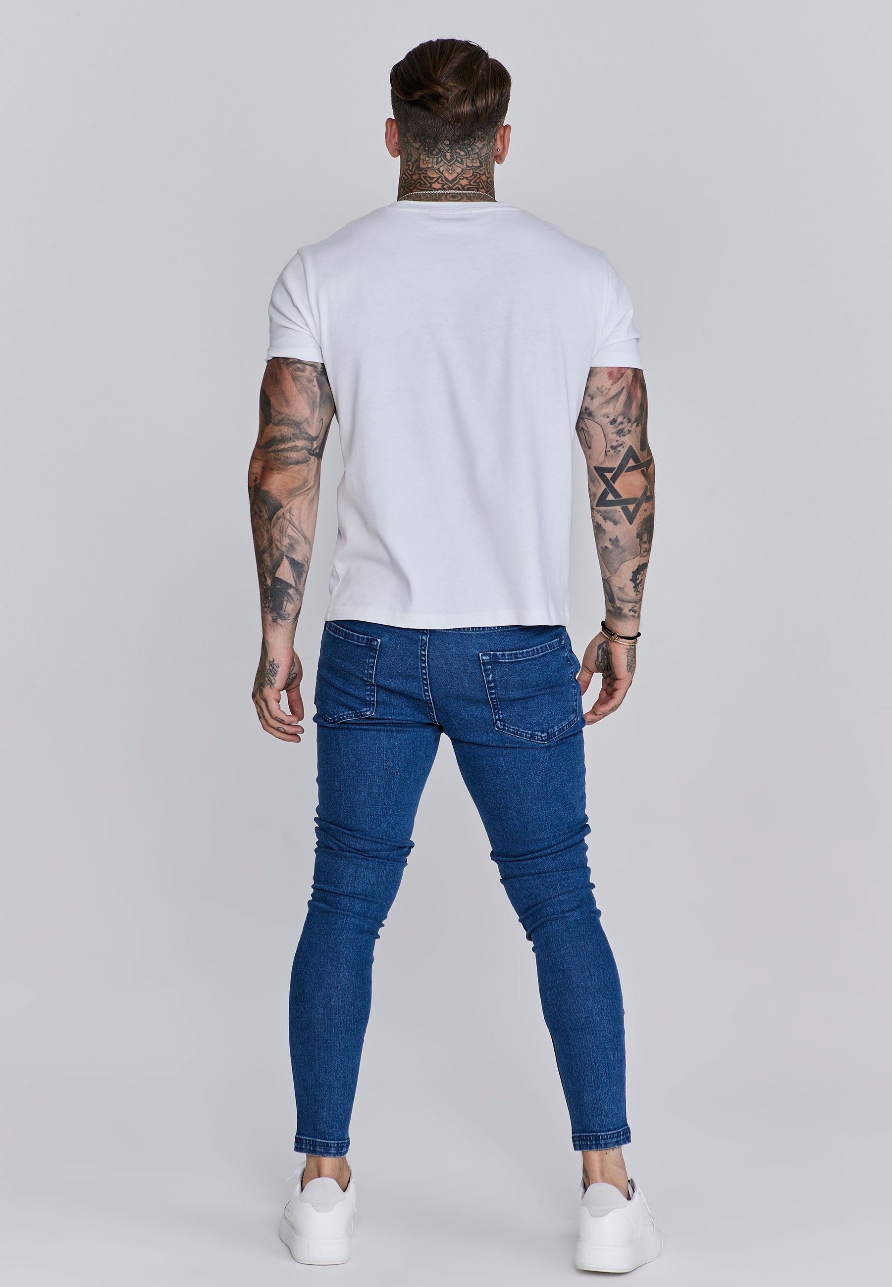 Distressed Skinny Jeans in Blue Jeans SikSilk