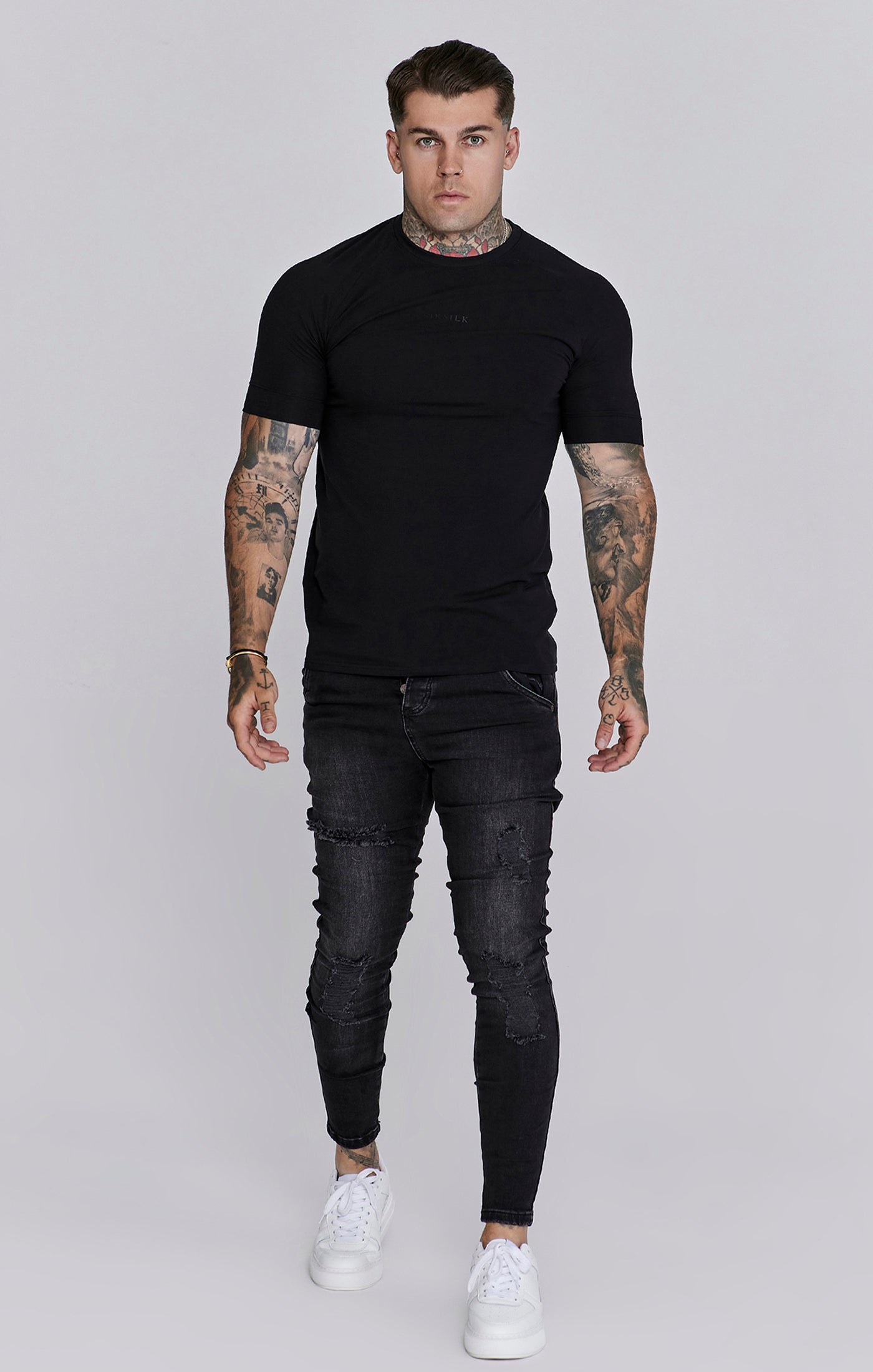 Distressed Skinny Jeans in Black Jeans SikSilk