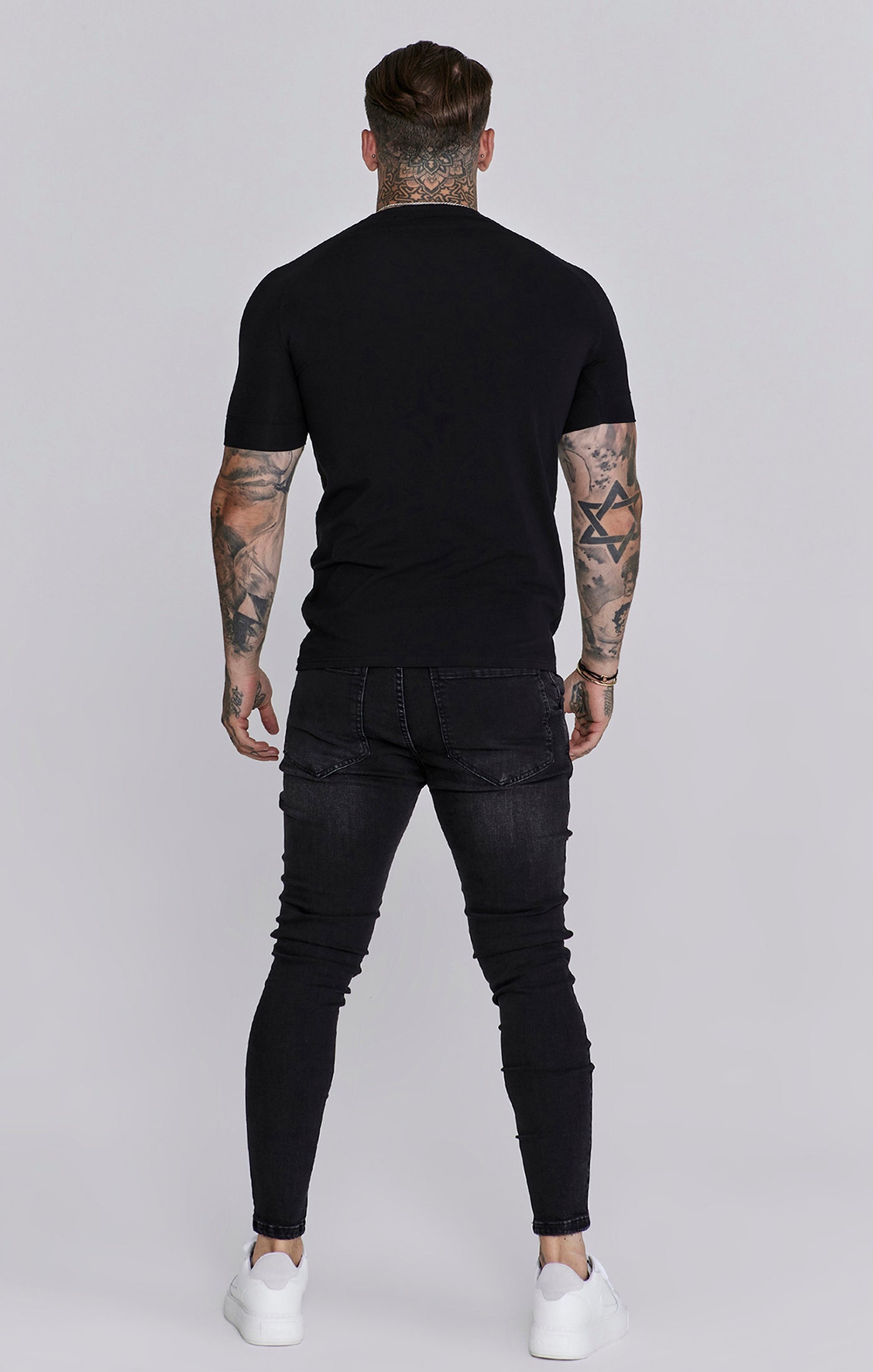 Distressed Skinny Jeans in Black Jeans SikSilk