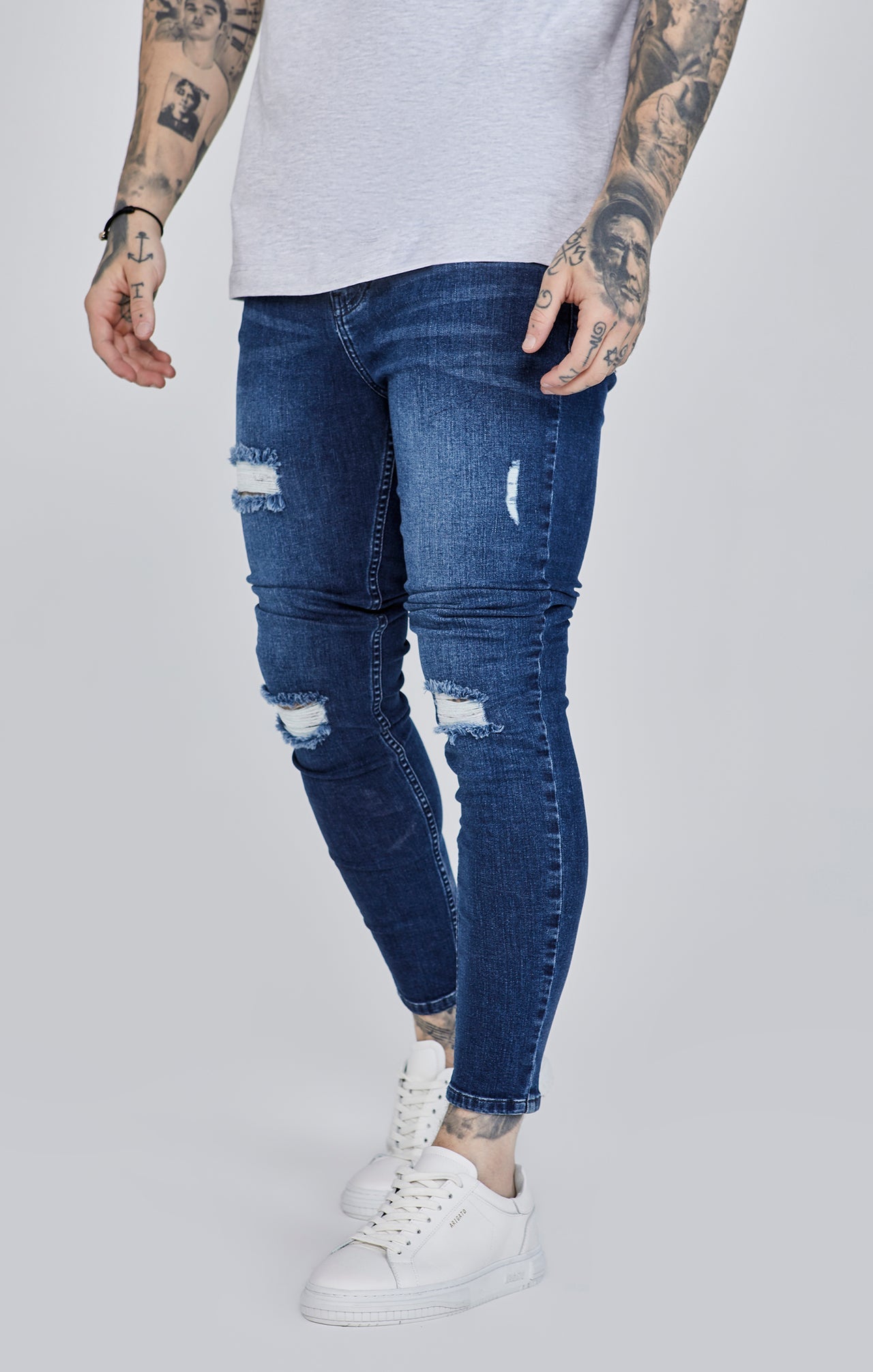 Distressed Skinny Jeans in Blue Jeans SikSilk   