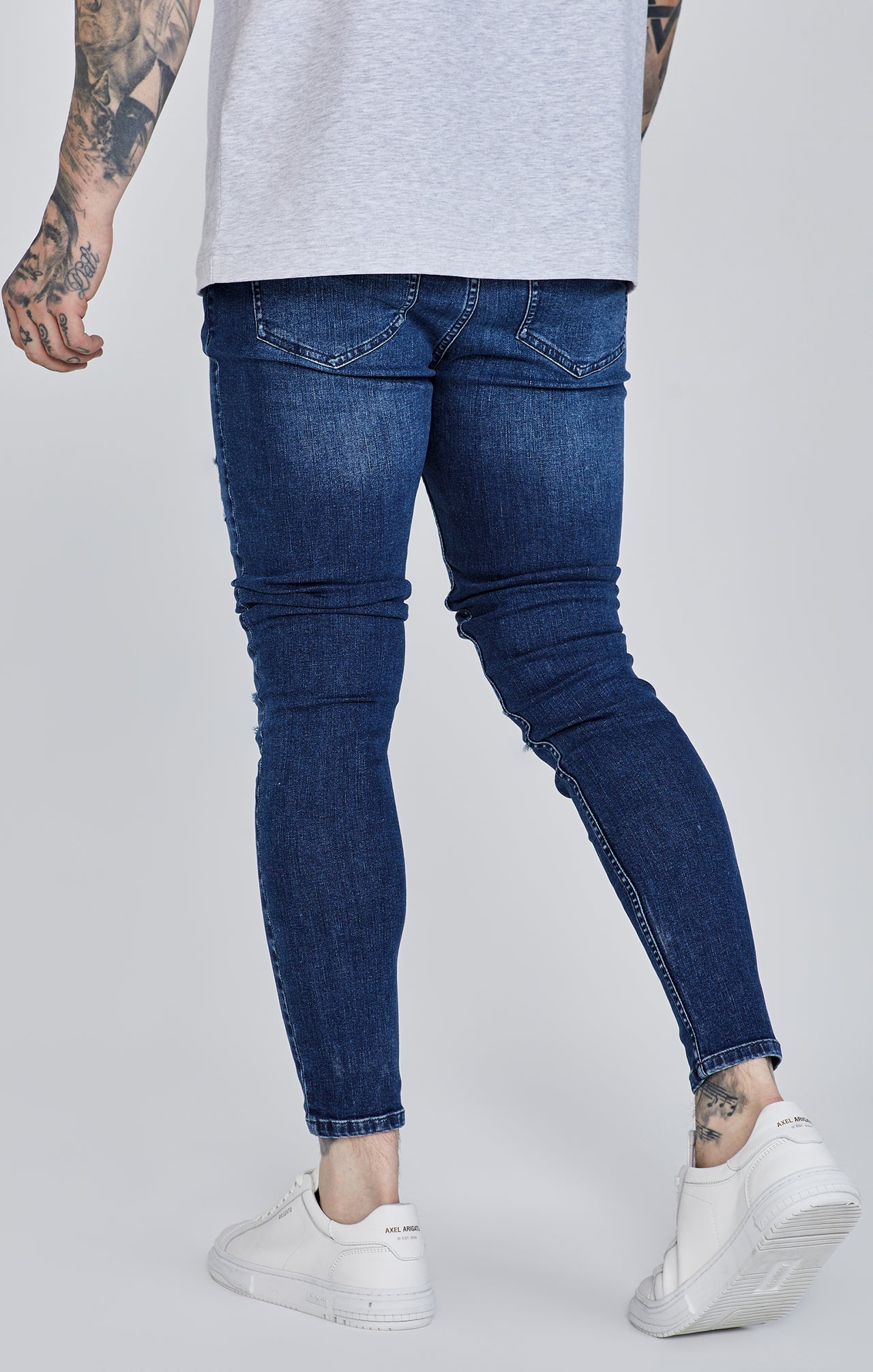 Distressed Skinny Jeans in Blue Jeans SikSilk   