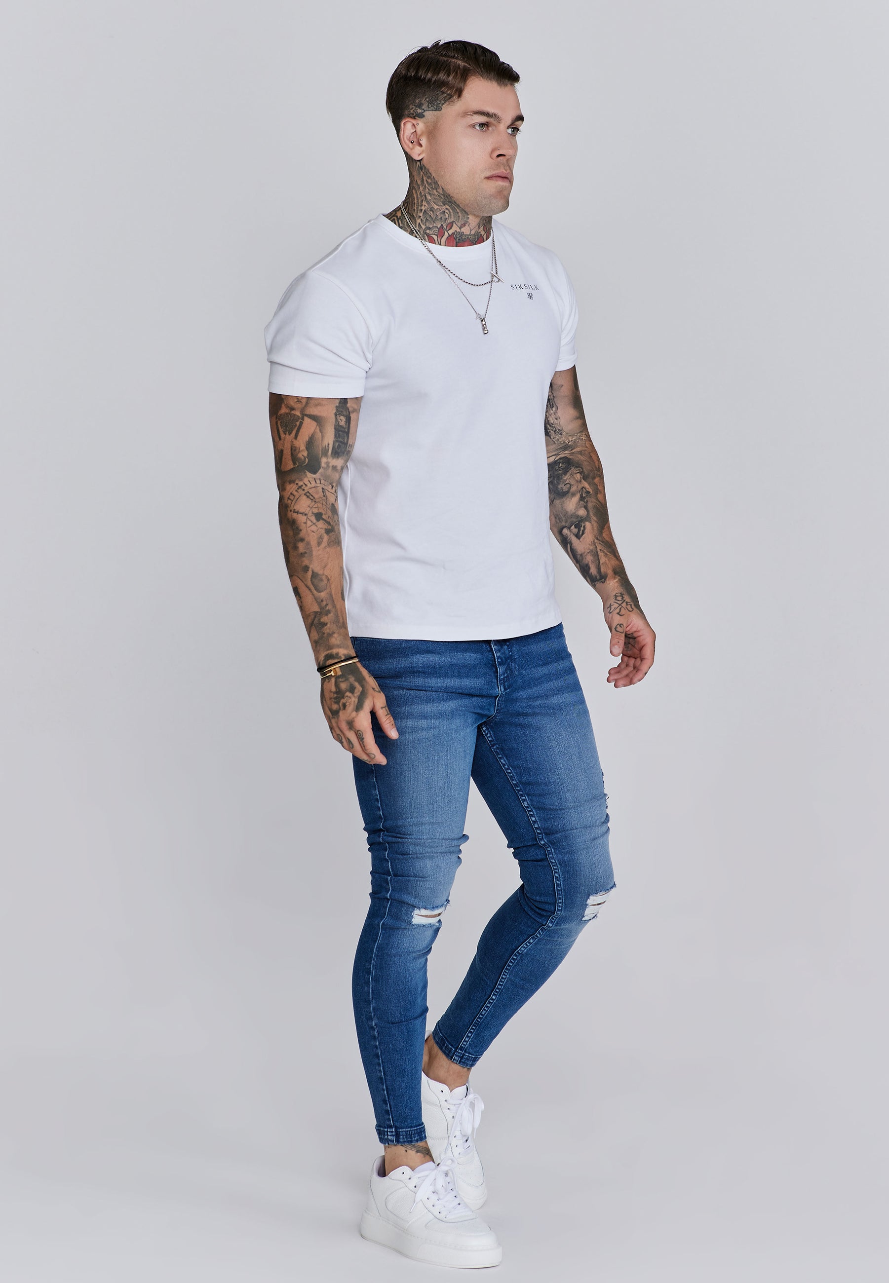 Distressed Skinny Jeans in Blue Jeans SikSilk
